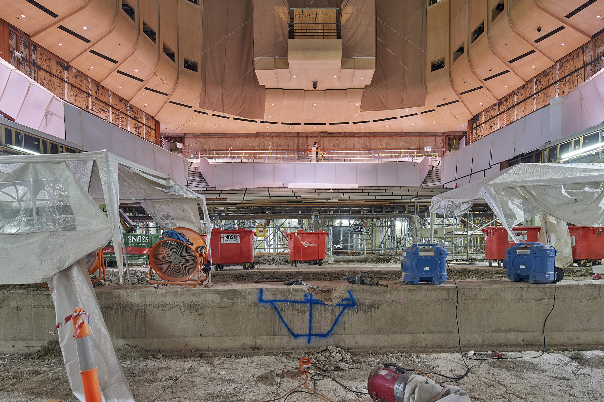 The old stage is getting cleared of any concrete debris.