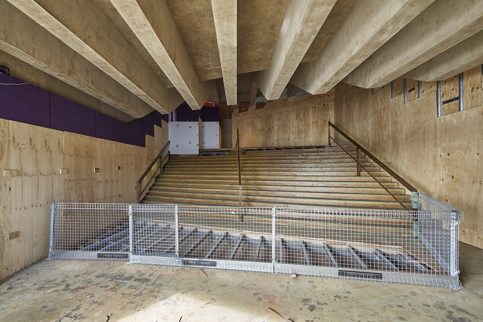 The carpet being stripped from the staircase of the Northern foyer.