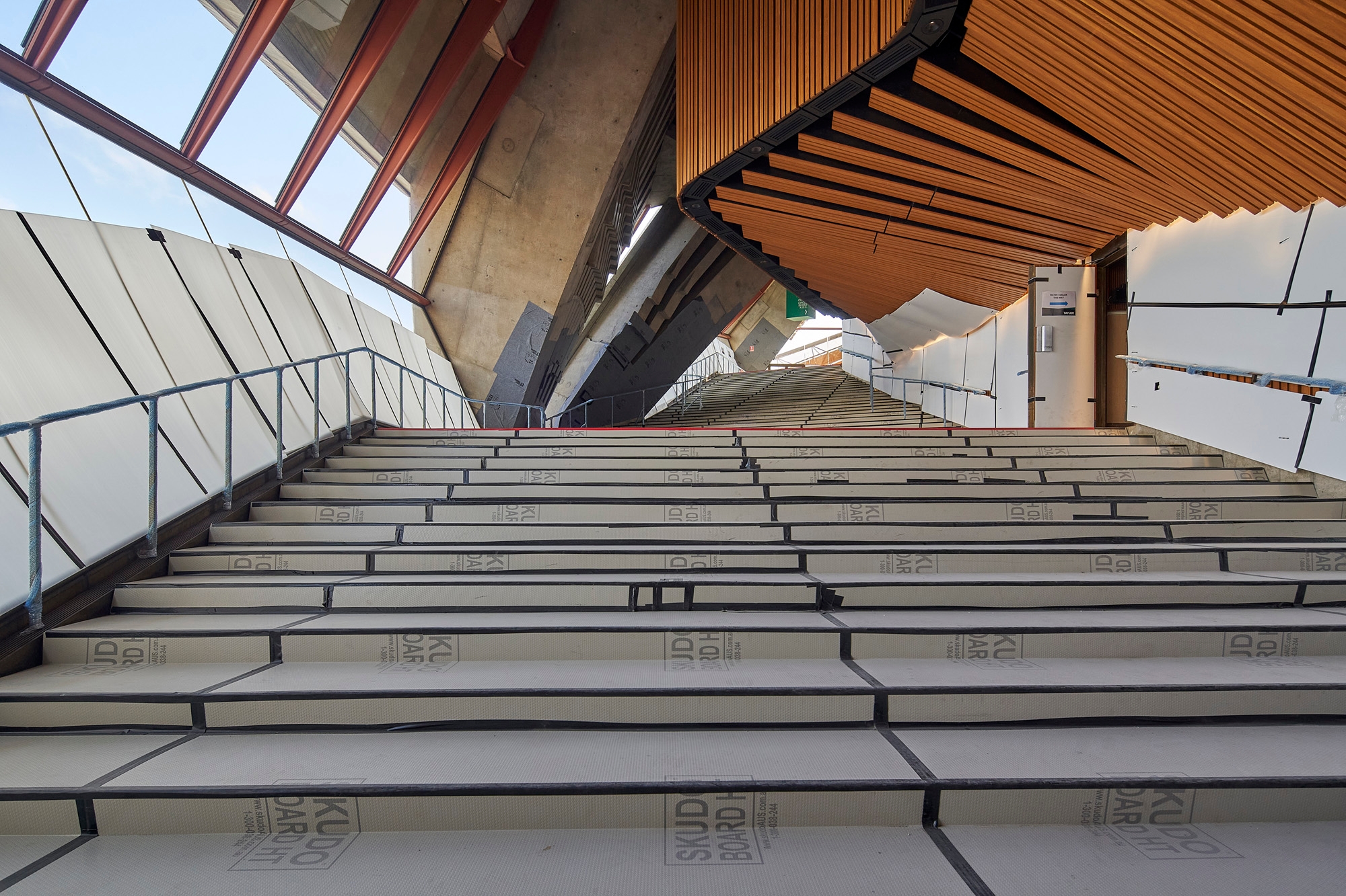 The granite stairs in the Western foyer covered with protective sheets.