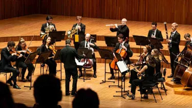 Sydney Symphony Fellows plays on stage with a variety of strings and woodwind.