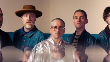 5 of the band members of Hot Chip looking forward into camera with serious faces
