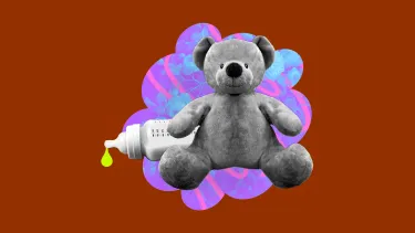 A gray teddy bear sits in front of a decorative purple and blue floral design. To the left, a baby bottle with a yellow drop is visible.