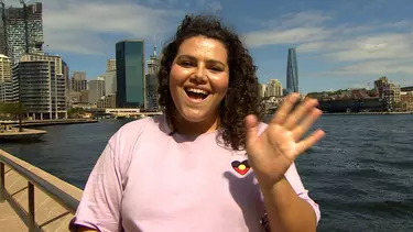 A woman in a pink top.