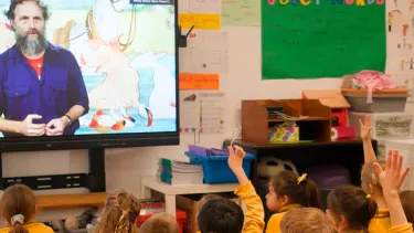 Kids learning in a digital classroom.