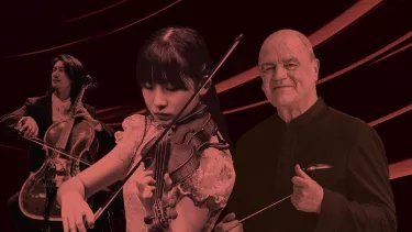 A Singaporean man and woman play the cello and violin respectively next to an older white man holding a conductor's baton, all basked in a red light filter.