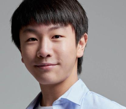 Australian violinist Christian Li in a blue collared shirt