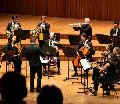 Sydney Symphony Fellows plays on stage with a variety of strings and woodwind.