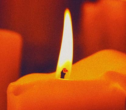 A set of lit red candles.