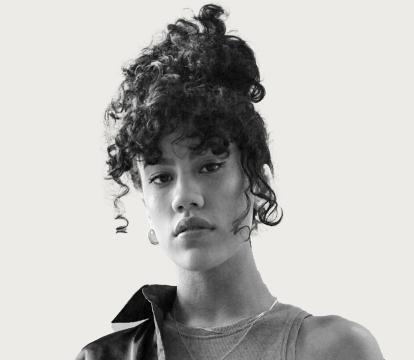 An Australian musician Becca Hatch wearing a black shirt.