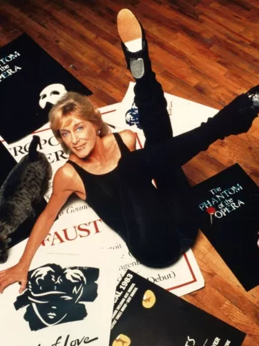 Gillian Lynne with posters of some of her most famous musicals Photo Lynne & Land Collection