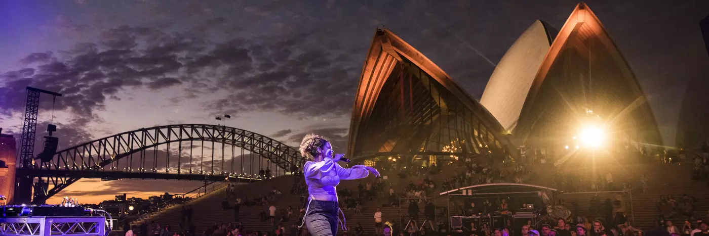 A crowd enjoying a music concert at the Forecourt.