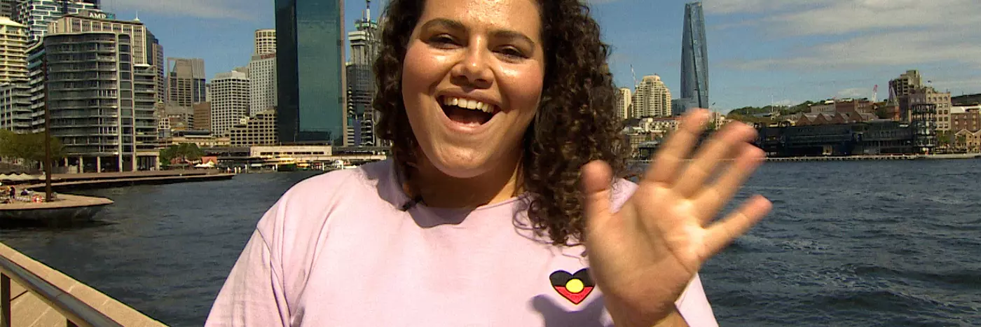 A woman in a pink top.