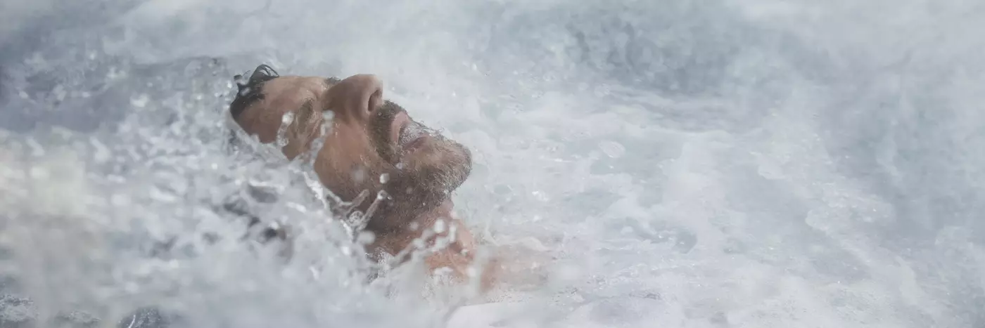 Man face up surrounded by water