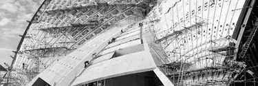 The sails of the Opera house under construction.